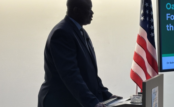 A man standing at a podium speaking