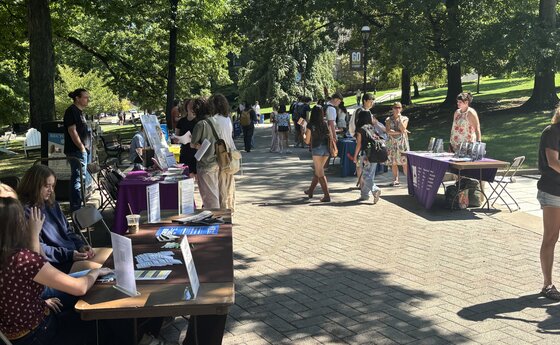 Several students at a study abroad fair outside