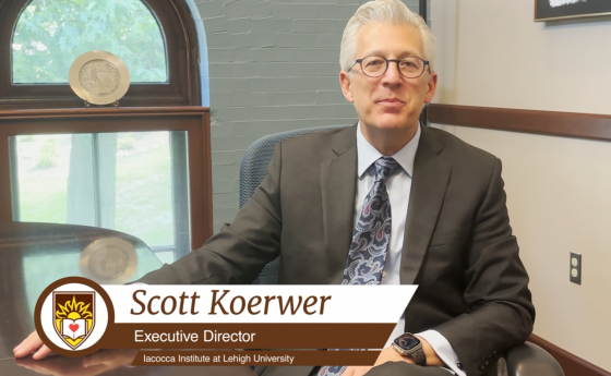 Scott Koerwer sitting in a chair in a conference room