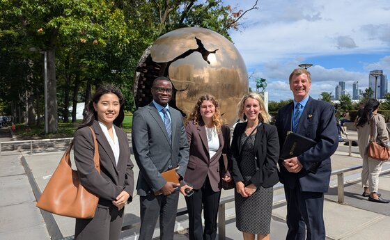 Five people at the United Nations headquarters in New York City