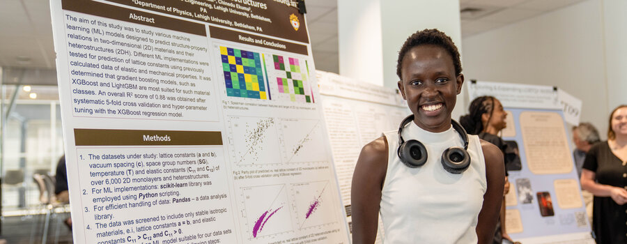 A young woman standing in front of an information display
