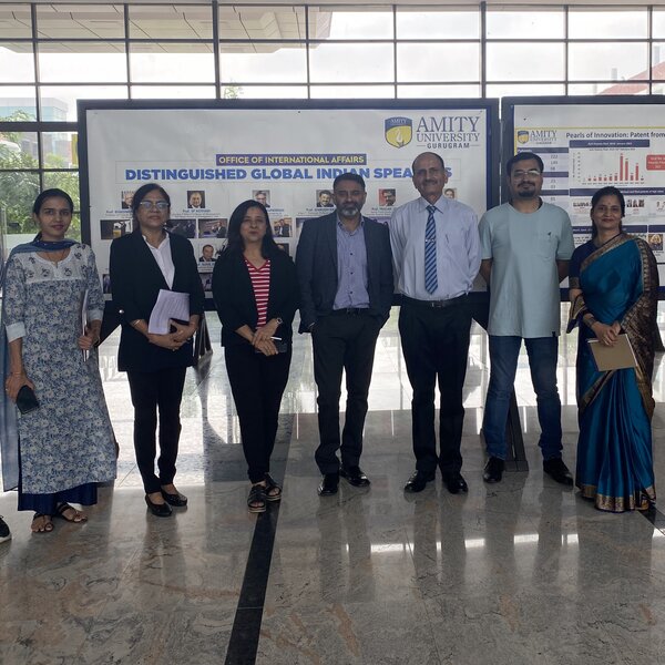 A group of people gathered for a photo in an Indian higher education institution