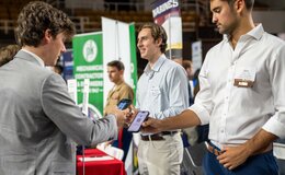 College students speaking at a career expo
