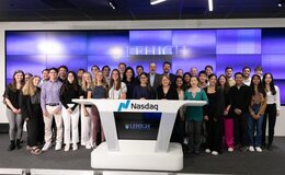 A large group of people standing at the Nasdaq Center