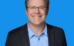 Ryan Grant in a black blazer and blue shirt 