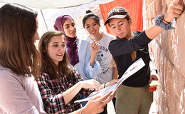 Stephanie Brabender ’21 ’22G (right) and other students work with Allison Mickel (second from left) in Jordan.