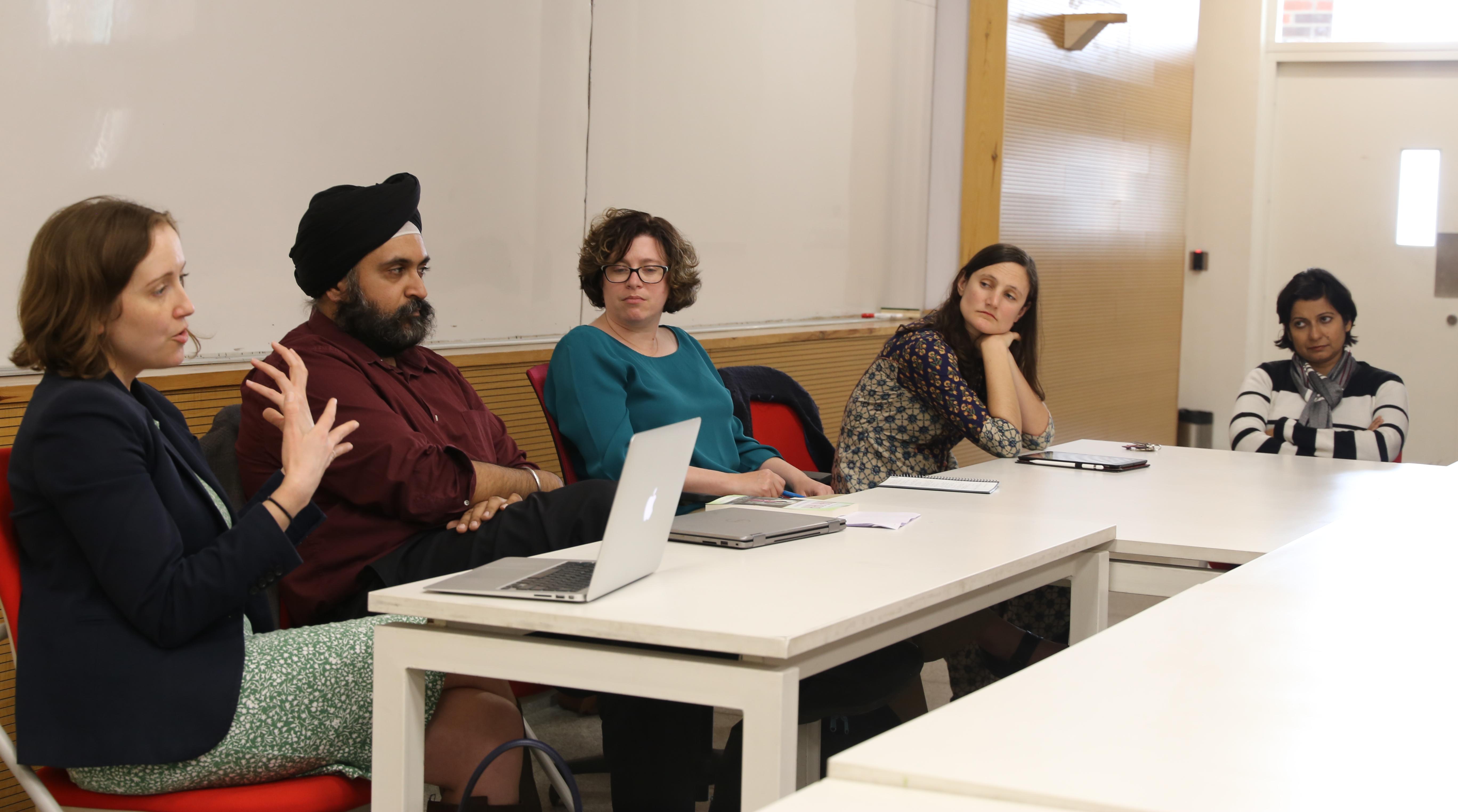Jenna Lay (left), associate professor of English at Lehigh, discusses her research with colleagues at Ashoka University.
