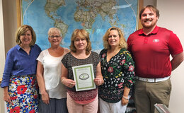 Office of International Affairs staff with their sustainability certificate