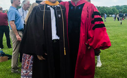 William Vu ’19 (left) with Todd Watkins, professor of economics, at commencement.